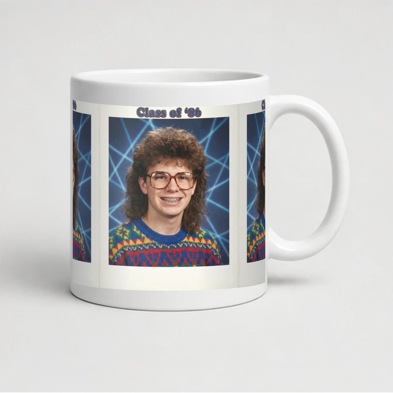 White ceramic mug showing a demonstration retro yearbook portrait on the print area